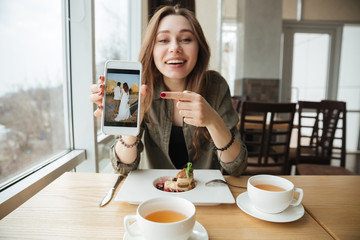 Smiling woman with phone