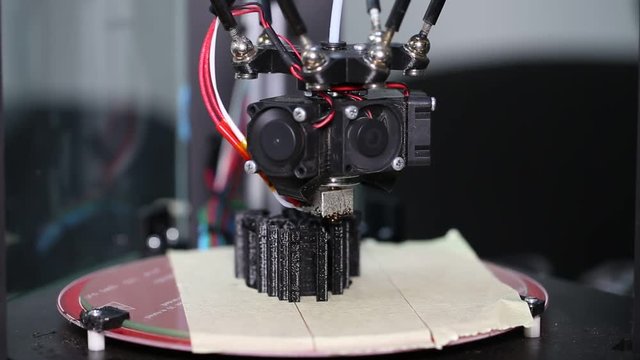 3d printer is typing 3d model of black mask. The video is shot close-up. This video was shot using Canon 5d Mark 3. If you liked this video, rate it, please!