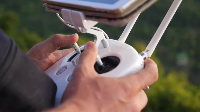 Remote Controller of Quadcopter in Male Hands Close Up