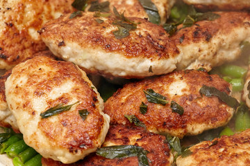 Meat rissoles or cutlets in frying pan, cooking process
