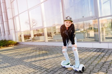 10 years old girl riding on self balancing electric skateboard