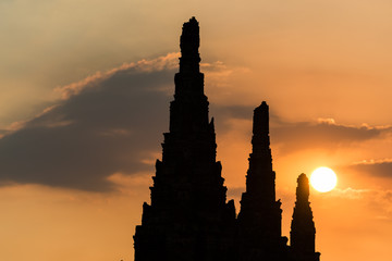 Colorful sunset sky with silhouette of ancient Buddhist temple