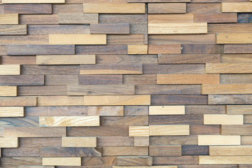 exposed wooden wall exterior, patchwork of raw wood forming a beautiful parquet wood pattern
