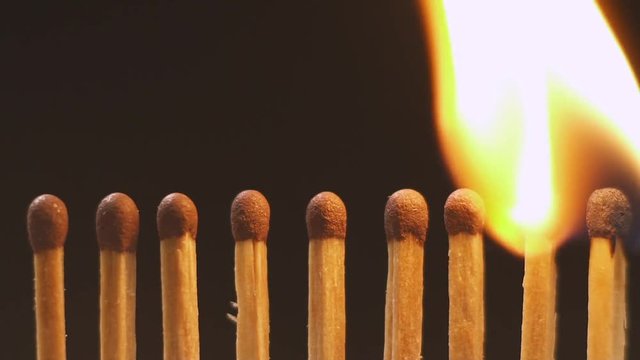 Burning matches, open fire. Slow motion. Close-up.
