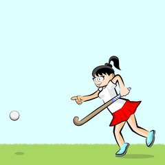 Female hockey player on grass