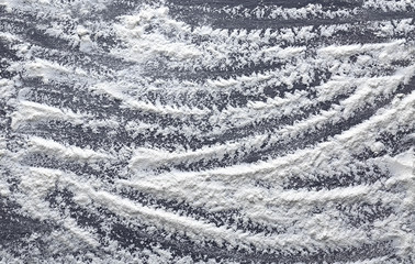 White flour on dark background, closeup