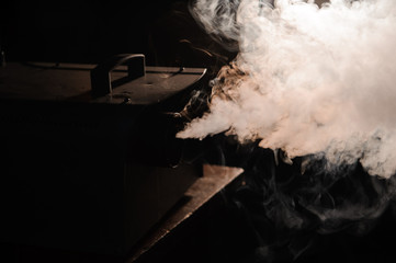 lights in smoke, studio lights shining through the smoke from smoke machine.