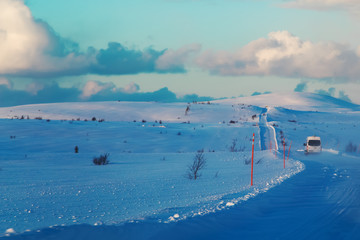 Road at winter tundra. Kola Peninsula, Russia