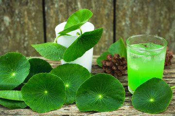 Herbal juice from Centella asiatica,wooden scene,Centella asiatica,Gotu kola