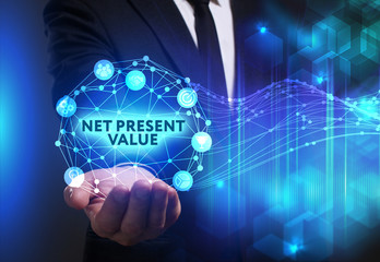 Business, Technology, Internet and network concept. Young businessman working on a virtual screen of the future and sees the inscription: Net present value