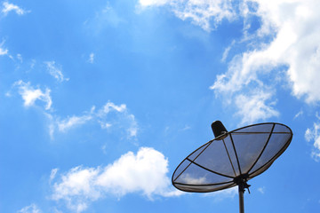 Satellite dish on the background of clouds and sky