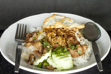 Pork stir-fried with garlic and peppercorns with egg.