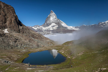 Reflection of Matterhorn and Rillelsee lake , Swiss Alps