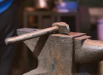 Hammer and anvil in blacksmith's house.