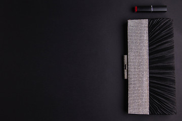 Female cocktail handbag with lipstick