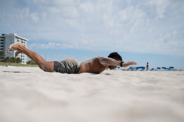 Fototapeta na wymiar Muscular Black man exercised on the beach