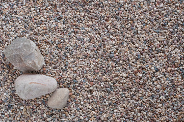 Three stone on shallow-stony beach