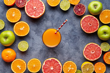 Fresh juices or smoothies with citrus fruit, apple, grapefruit on light background. Top view. Refreshing homemade lemonade. Detox, dieting, clean eating, vegetarian, vegan, healthy lifestyle concept