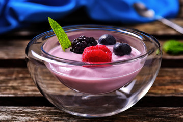Close up of blueberries, raspberries and yogurt