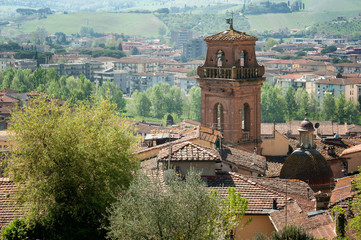 Fototapeta na wymiar the bell tower of the Saint Leonardo and Lorenzo church, Castelfiorentino