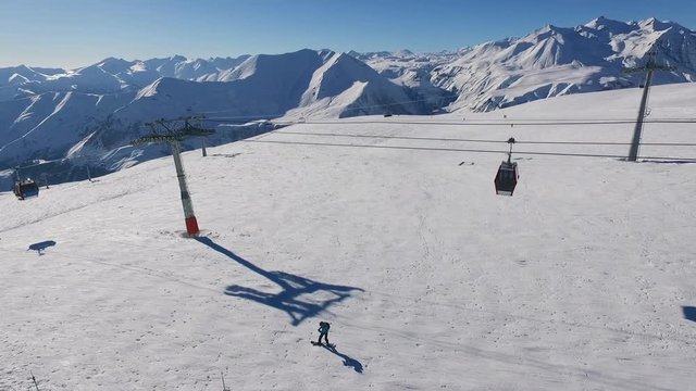 View from drone of poma lift on mountain ski resort in slowmotion