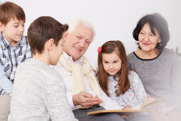 Fototapeta premium Family watching photo album