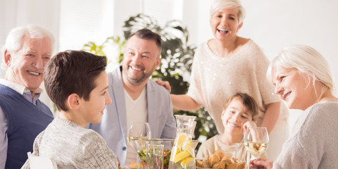 Happy family eating meal together