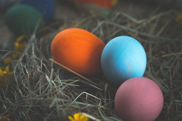 Easter eggs in colored buckets.