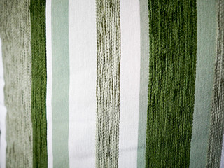 Fototapeta premium Macro of a green line pattern pillow.