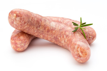 Raw sausage with parsley leaf isolated on white background.