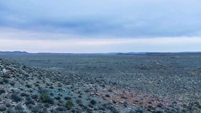 A static timelapse of a typical Karoo Landscape on a cool overcast day with a thick set of clouds blowing over
