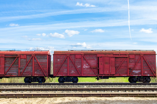 Fototapeta Red train wagons on railroad