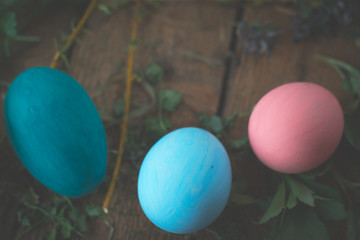 Fototapeta na wymiar Colored easter eggs on wooden background.