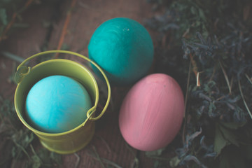 Easter eggs in colored buckets.