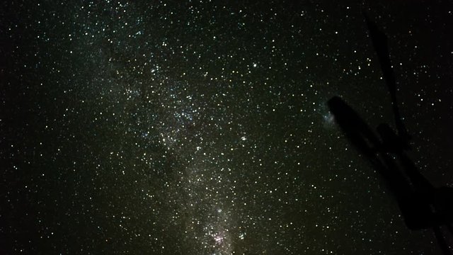 A slow pan night time-lapse of a windmill blowing in the wind against the African Milky Way from blue hour through to dark skies with a focus pull from focus to out of focus