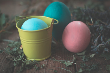Easter eggs in colored buckets.