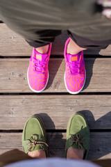 woman and man standing close feet