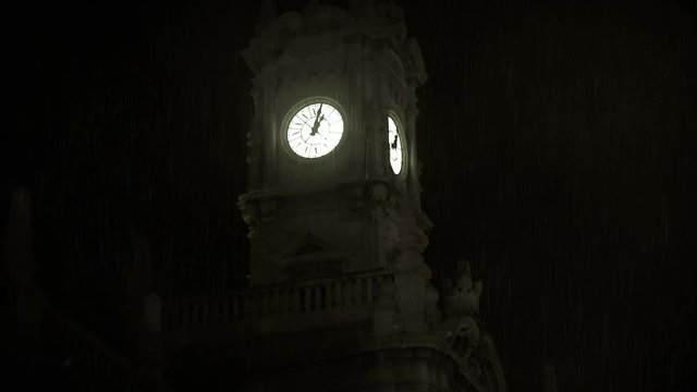 Lightening striking creepy clocktower in rainstorm Halloween abstract