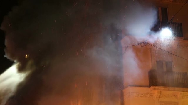 Firefighting apartment building fire heavy billowing smoke Spain Europe