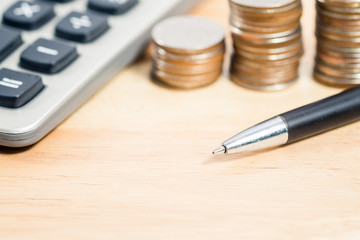 Wood table, calculator and investment