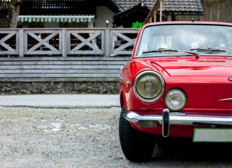 red retro car in the countryside