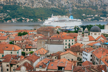 Liner on the dock in Kotor, near the Old Town in Bay of Kotor, Montenegro. The view from the observation deck over the city.