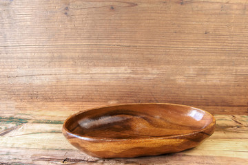 Wood bowl on wood background
