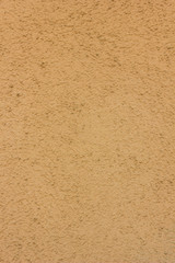 Yellow or orange concrete wall texture as a background.
