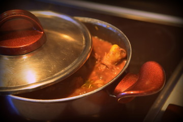 pan with chicken and sauce 
