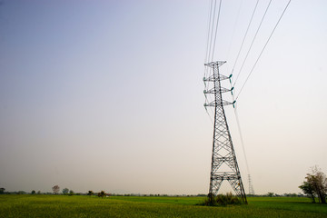  high voltage pole on field. countryside high voltage pole.