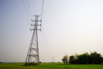  high voltage pole on field. countryside high voltage pole.