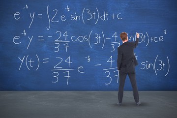 Composite image of rear view businessman writing with chalk