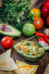 Avocado boat - guacamole dip in boat made from avocado skin.