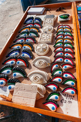 Good luck eyes and Maltese cross, traditional souvenirs for tourists on Malta.